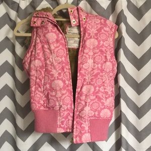 Pink furry sleeveless vest with hood